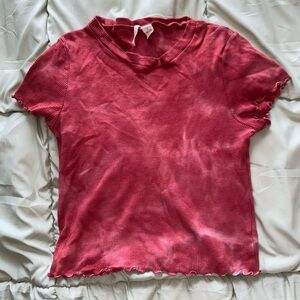 red tie dye top with slightly ruffled sleeves